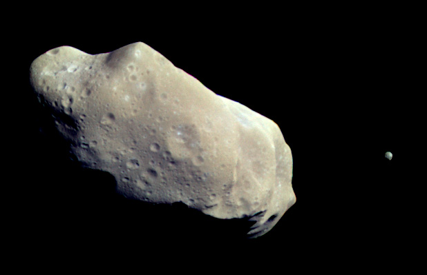  Asteroid 243 Ida and its small moon Dactyl. This color image was created from images taken by the Galileo spacecraft about 14 minutes before its closest approach on August 28, 1993. Credit: NASA